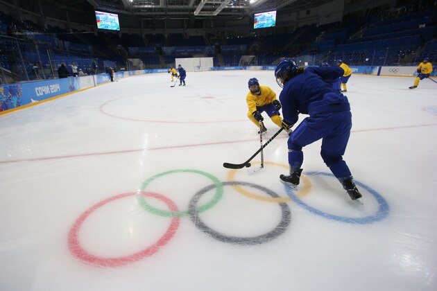SOCHI, RUSSIA - FEBRUARY 05:  Anna Borgqvist #18 and Emilia Andersson #10 of Sweden practice during a women's ice hockey training session ahead of the Sochi 2014 Winter Olympics at Shayba Arena on February 5, 2014 in Sochi, Russia.  (Photo by Bruce Bennett/Getty Images)
