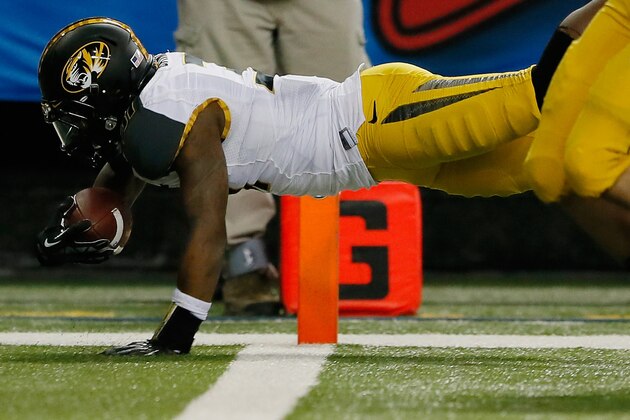 ATLANTA, GA - DECEMBER 07: E.J. Gaines #31 of the Missouri Tigers dives across the endzone to score a touchdown after recovering a fumble in the second quarter against the Auburn Tigers during the SEC Championship Game at Georgia Dome on December 7, 2013 in Atlanta, Georgia.  (Photo by Kevin C. Cox/Getty Images)