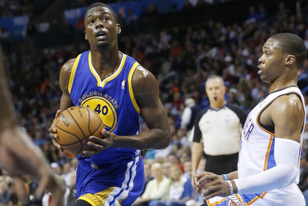 Golden State Warriors forward Harrison Barnes (40) drives around Oklahoma City Thunder guard Russell Westbrook (0) in the first quarter of an NBA basketball game in Oklahoma City, Friday, Nov. 29, 2013. (AP Photo/Sue Ogrocki)