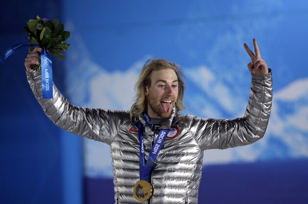 Gold medal winner Sage Kotsenburg acknowledges fans during the medal ceremony for the Snowboard Men's Slopestyle competition at the 2014 Winter Olympics, Saturday, Feb. 8, 2014, in Sochi, Russia. (AP Photo/David J. Phillip )