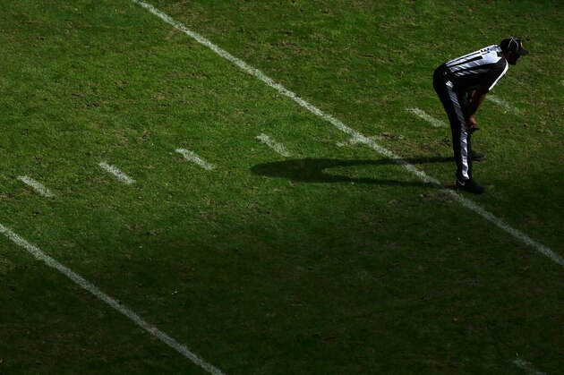 HOUSTON, TX - DECEMBER 22:  An official waits on the field during the first half of the game between the  Denver Broncos and the Houston Texans at Reliant Stadium on December 22, 2013 in Houston, Texas.  (Photo by Scott Halleran/Getty Images)