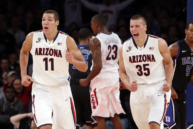 Arizona's Aaron Gordon (11) and Kaleb Tarczewski (35) react after a basket by Rondae Hollis-Jefferson (23) against Duke during the second half of an NCAA college basketball game in the championship of the NIT Season Tip-off tournament Friday, Nov. 29, 2013, in New York. Arizona won 72-66. (AP Photo/Jason DeCrow) Arizona's Aaron Gordon (11) and Kaleb Tarczewski (35) react after a basket by Rondae Hollis-Jefferson (23) against Duke during the second half of an NCAA college basketball game in the championship of the NIT Season Tip-off tournament Friday, Nov. 29, 2013, in New York. Arizona won 72-66. (AP Photo/Jason DeCrow)