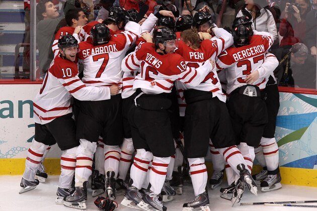 VANCOUVER, BC - FEBRUARY 28:  Team Canada celebrate after Sidney Crosby (obscured) #87 of Canada scored the match-winning goal in overtime during the ice hockey men's gold medal game between USA and Canada on day 17 of the Vancouver 2010 Winter Olympics at Canada Hockey Place on February 28, 2010 in Vancouver, Canada.  Canada defeated USA 3-2.  (Photo by Alex Livesey/Getty Images)