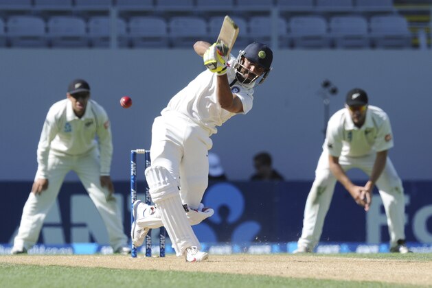 India’s Ravindra Jadeja hits out to be caught by New Zealand’s Ish Sodhi for 26 on the fourth day of the first cricket test at Eden Park in Auckland, New Zealand, Sunday, Feb. 9, 2014.(AP Photo/SNPA, Ross Setford) NEW ZEALAND OUT