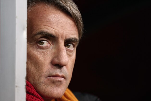 Galatasaray's coach Roberto Mancini watches his team during their Champions League Group B soccer match against Juventus, at the TT Arena Stadium in Istanbul, Turkey, Tuesday, Dec. 10, 2013. (AP Photo)