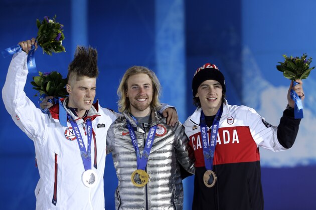 Silver medalist Staale Sandbech, left, of Norway, gold medalist Sage Kotsenburg, of the United States, center, and  bronze medalist Mark McMorris, right, of Canada, pose on the podium during the medal ceremony for the Snowboard Men's Slopestyle competition at the 2014 Winter Olympics, Saturday, Feb. 8, 2014, in Sochi, Russia. (AP Photo/David J. Phillip )