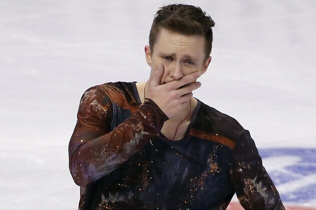 Jeremy Abbott reacts after skating  in the men's free skate at the U.S. Figure Skating Championships in Boston, Sunday, Jan. 12, 2014. (AP Photo/Elise Amendola)