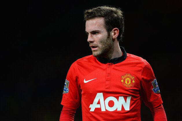 MANCHESTER, ENGLAND - JANUARY 28:  New signing Juan Mata of Manchester United looks on during the Barclays Premier League match between Manchester United and Cardiff City at Old Trafford on January 28, 2014 in Manchester, England.  (Photo by Michael Regan/Getty Images)
