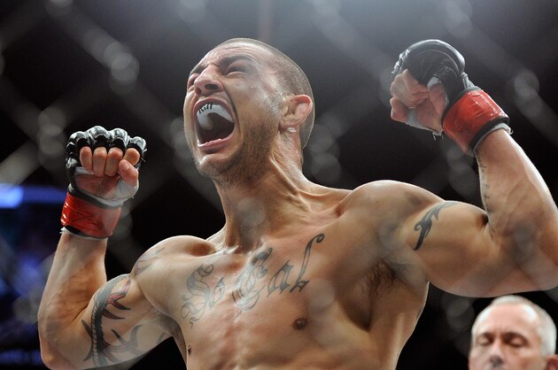 Cub Swanson reacts after defeating Dennis Siver during the third round of their UFC 162 mixed martial arts featherweight bout at the MGM Grand Garden Arena on Saturday, July 6, 2013, in Las Vegas. (AP Photo/David Becker)
