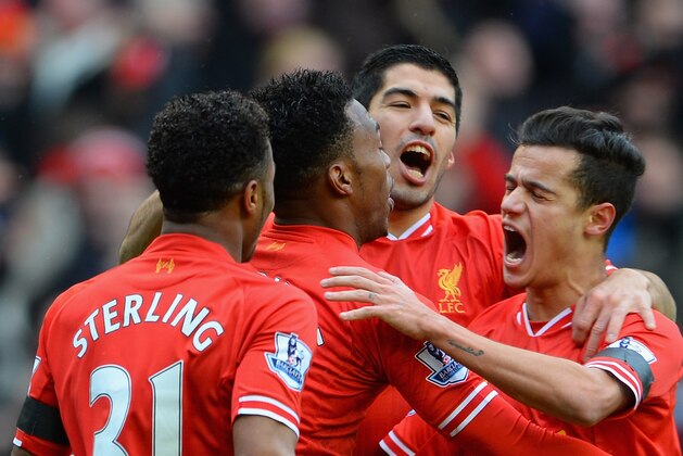 LIVERPOOL, ENGLAND - FEBRUARY 08:  Daniel Sturridge of Liverpool celebrates with his team-mates after scoring the fourth goal during the Barclays Premier League match between Liverpool and Arsenal at Anfield on February 8, 2014 in Liverpool, England.  (Photo by Michael Regan/Getty Images)