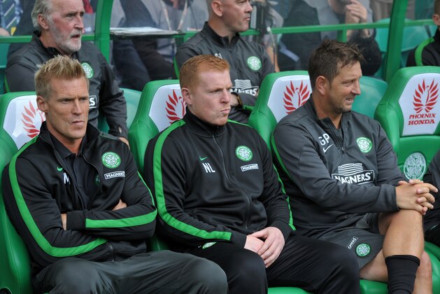 GLASGOW, SCOTLAND - AUGUST 03:  Celtic manager Neil Lennon (centre) in the dugout with assistants Johan Mjallby (left) and Garry Parker (right) at the start of the Scottish Premier League game between Celtic and Ross County at Celtic Park Stadium on August 03, 2013 in Glasgow, Scotland. (Photo by Mark Runnacles/Getty Images)