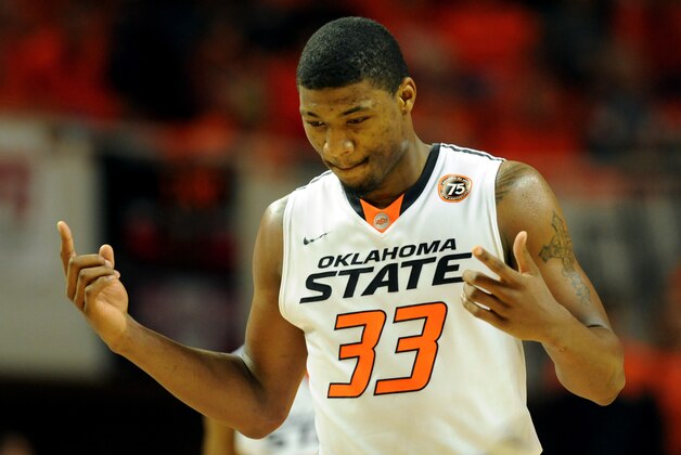 Oklahoma State guard Marcus Smart celebrates after being fouled during the second half of an NCAA college basketball game in Stillwater, Okla., Tuesday, Nov. 19, 2013. Smart set a personal scoring record with 39 points in the 101-80 win over Memphis. (AP Photo/Brody Schmidt)