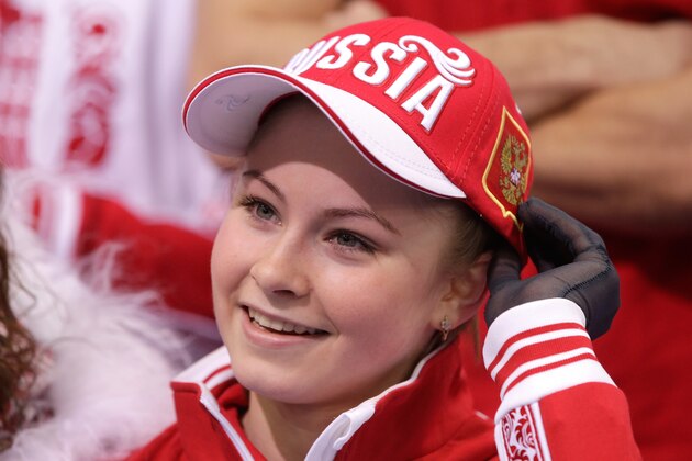 SOCHI, RUSSIA - FEBRUARY 09:  Yulia Lipnitskaya of Russia looks on while waiting for her score in the Team Ladies Free Skating during day two of the Sochi 2014 Winter Olympics at Iceberg Skating Palace onon February 9, 2014 in Sochi, Russia.  (Photo by Pool/Getty Images)