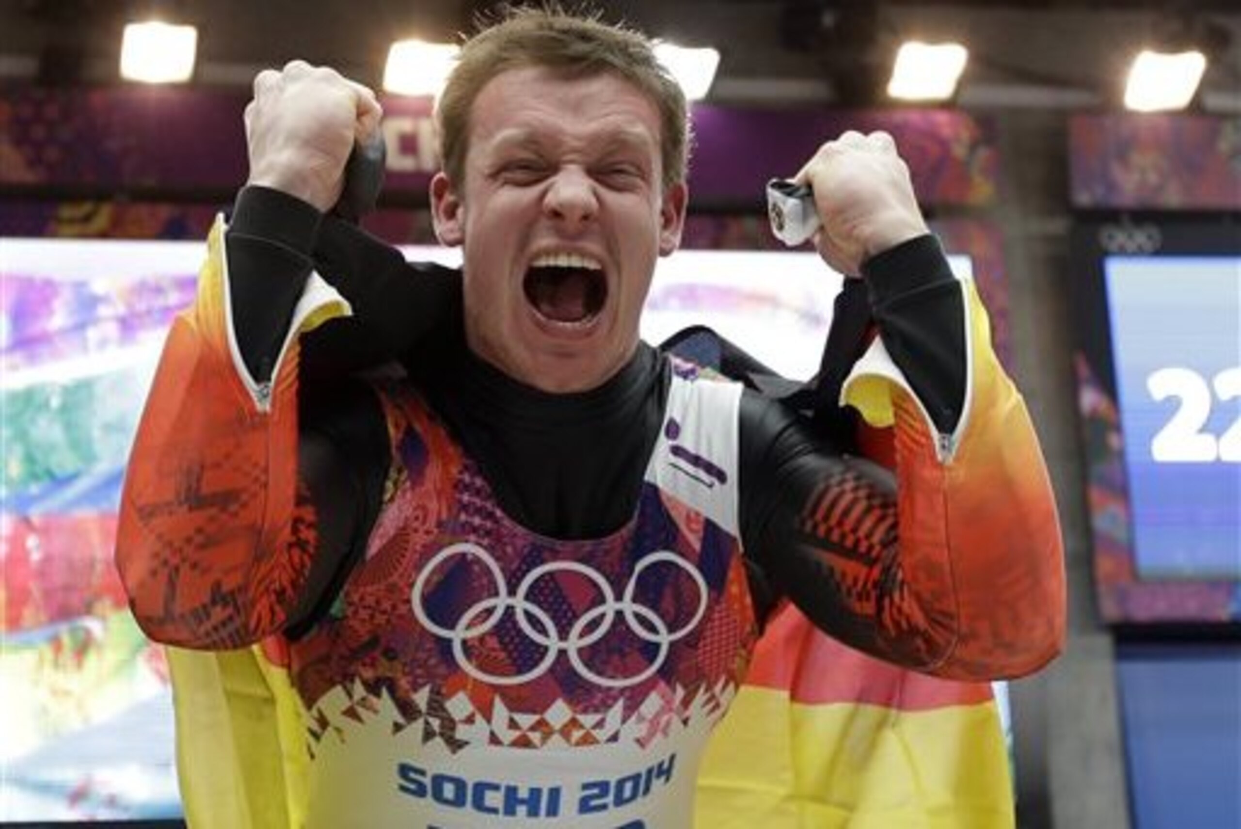 Felix Loch of Germany celebrates after he crossed the finish area to win the gold medal during the men's singles luge final at the 2014 Winter Olympics, Sunday, Feb. 9, 2014, in Krasnaya Polyana, Russia.  (AP Photo/Natacha Pisarenko)