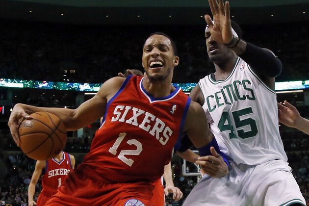 Philadelphia 76ers forward Evan Turner (12) makes a move against Boston Celtics forward Gerald Wallace (45) during the first half of an NBA basketball game in Boston, Wednesday, Jan. 29, 2014. (AP Photo/Elise Amendola)