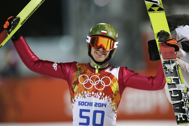 Poland's Kamil Stoch celebrates winning the gold medal after the men's normal hill ski jumping final at the 2014 Winter Olympics, Sunday, Feb. 9, 2014, in Krasnaya Polyana, Russia. (AP Photo/Gregorio Borgia)