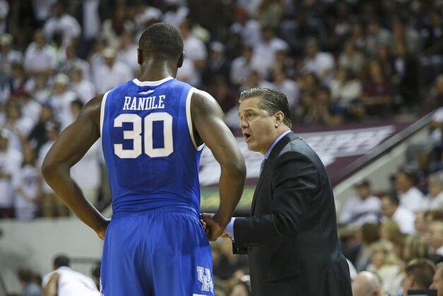 Feb 8, 2014; Starkville, MS, USA; Kentucky Wildcats head coach John Calipari has a discussion with Kentucky Wildcats forward Julius Randle (30) during the game against the Mississippi State Bulldogs at Humphrey Coliseum. Mandatory Credit: Spruce Derden-USA TODAY Sports