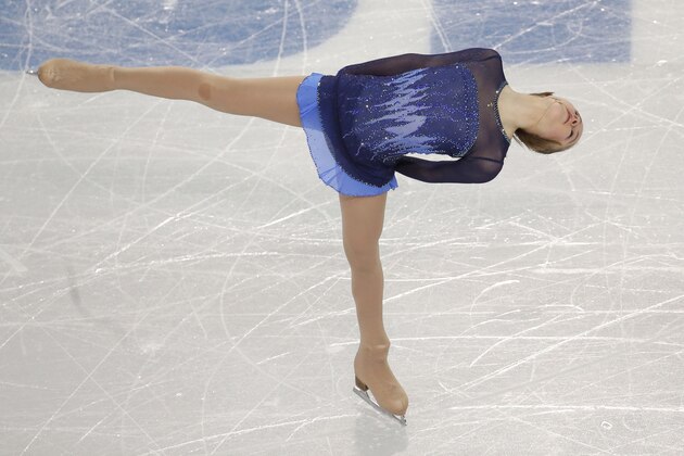 Yulia Lipnitskaya of Russia competes in the women's team short program figure skating competition at the Iceberg Skating Palace during the 2014 Winter Olympics, Saturday, Feb. 8, 2014, in Sochi, Russia. (AP Photo/Bernat Armangue)