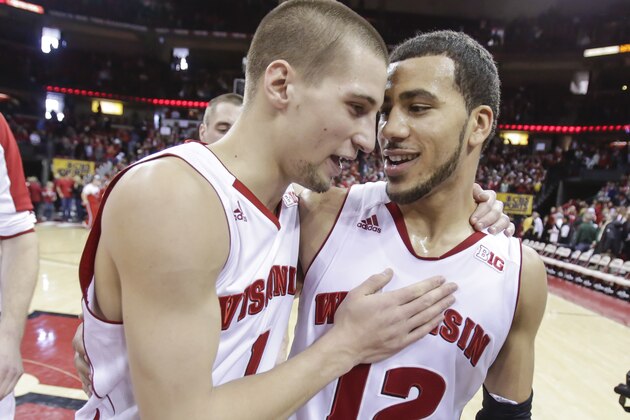 Wisconsin's Ben Brust, left, and Traevon Jackson celebrate after they defeated Michigan State 60-58 in an NCAA college basketball game on Sunday, Feb. 9, 2014, in Madison, Wis. Jackson made the game-winning basket in the final seconds of play. (AP Photo/Andy Manis)