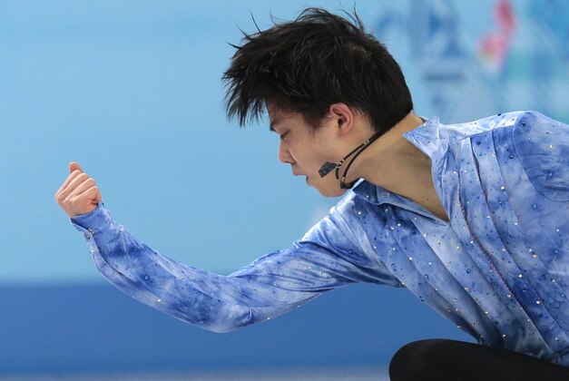 Yuzuru Hanyu of Japan competes in the men's team short program figure skating competition at the Iceberg Skating Palace during the 2014 Winter Olympics, Thursday, Feb. 6, 2014, in Sochi, Russia. (AP Photo/Ivan Sekretarev)