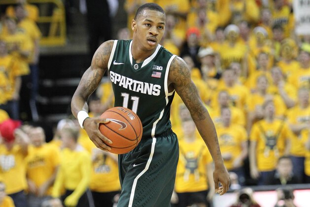 Jan 28, 2014; Iowa City, IA, USA; Michigan State Spartans guard Keith Appling (11) controls the ball during their game with the Iowa Hawkeyes during the second half at Carver-Hawkeye Arena. Michigan State beat Iowa 71-69.  Mandatory Credit: Reese Strickland-USA TODAY Sports