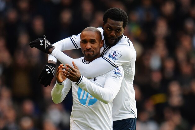 LONDON, ENGLAND - FEBRUARY 09:  Jermain Defoe (L) of Tottenham Hotspur is embraced by his team mate Emmanuel Adebayor (R) at the end of his final home game before joining Toronto FC following the Barclays Premier League match between Tottenham Hotspur and Everton at White Hart Lane on February 9, 2014 in London, England.  (Photo by Shaun Botterill/Getty Images)