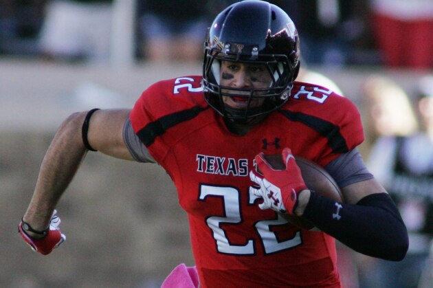 Oct 13, 2012; Lubbock, TX, USA; Texas Red Raiders tight end Jace Amaro (22) rushes against the West Virginia Mountaineers in the first half at Jones AT&T Stadium. Mandatory Credit: Michael C. Johnson-USA TODAY Sports
