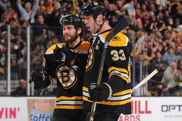 BOSTON, MA - MARCH 27: Zdeno Chara #33 and Adam McQuaid #54 of the Boston Bruins celebrate a goal against the Tampa Bay Lightning at the TD Garden on March 27, 2012 in Boston, Massachusetts.  (Photo by Steve Babineau/NHLI via Getty Images)