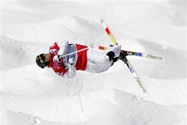 Canada's Alex Bilodeau jumps during freestyle skiing moguls training at the Rosa Khutor Extreme Park ahead of the 2014 Winter Olympics, Friday, Feb. 7, 2014, in Krasnaya Polyana, Russia. (AP Photo/Andy Wong)