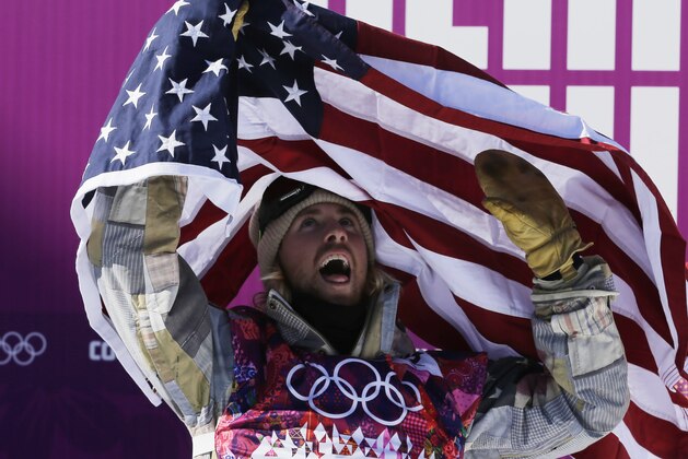 United States' Sage Kotsenburg celebrates after winning the men's  snowboard slopestyle final at the Rosa Khutor Extreme Park, at the 2014 Winter Olympics, Saturday, Feb. 8, 2014, in Krasnaya Polyana, Russia. (AP Photo/Andy Wong)