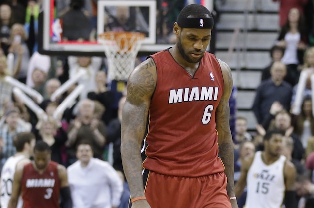 Miami Heat's LeBron James walks off the court at the end of an NBA basketball game against the Utah Jazz on Saturday, Feb. 8, 2014, in Salt Lake City. The Jazz won 94-89. (AP Photo/Rick Bowmer)
