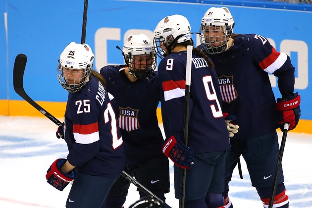 SOCHI, RUSSIA - FEBRUARY 08:  Kelli Stack #16 of United States celebrates with her teammate Hilary Knight #21, Alex Carpenter #25 and Megan Bozek #9 after scoring a goal in the second period against Noora Raty #41 of Finland during the Women's Ice Hockey Preliminary Round Group A Game on day 1 of the Sochi 2014 Winter Olympics at Shayba Arena on February 8, 2014 in Sochi, Russia.  (Photo by Martin Rose/Getty Images)