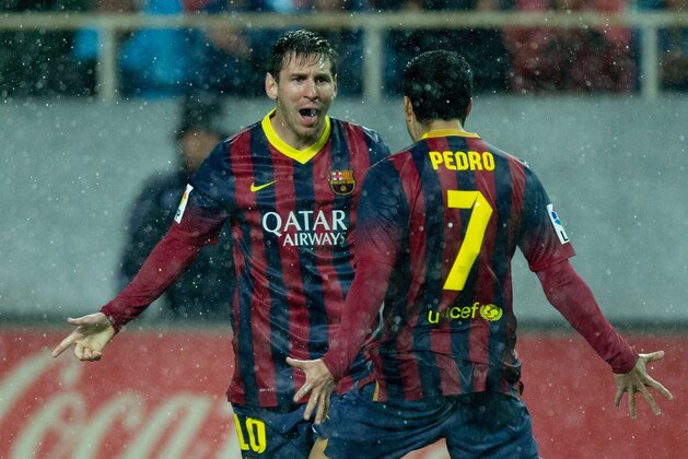 SEVILLE, SPAIN - FEBRUARY 09:  Lionel Messi of FC Barcelona celebrates scoring their second goal during the La Liga match between Sevilla FC and FC Barcelona at Estadio Ramon Sanchez Pizjuan on February 9, 2014 in Seville, Spain.  (Photo by Gonzalo Arroyo Moreno/Getty Images)