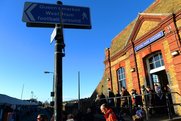 LONDON, ENGLAND - DECEMBER 28:  Football fans arrive at Upton Park Station during the Barclays Premier League match between West Ham United and West Bromwich Albion at Boleyn Ground on December 28, 2013 in London, England.  (Photo by Christopher Lee/Getty Images)