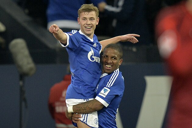 Schalke's Max Meyer, up, celebrates his goal  with  Schalke's second scorer Jefferson Farfan of Peru  during the German Bundesliga soccer match between FC Schalke 04 and SV Hannover 96 in Gelsenkirchen,  Germany, Sunday, Feb. 9, 2014. (AP Photo/Martin Meissner)