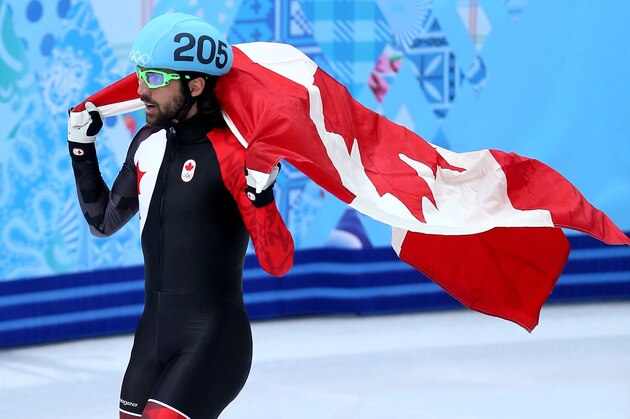 SOCHI, RUSSIA - FEBRUARY 10:  Gold medalist Charles Hamelin of Canada celebrates after wiining the Short Track Men's 1500m Final on day 3 of the Sochi 2014 Winter Olympics at Iceberg Skating Palace on February 10, 2014 in Sochi, Russia.  (Photo by Matthew Stockman/Getty Images)