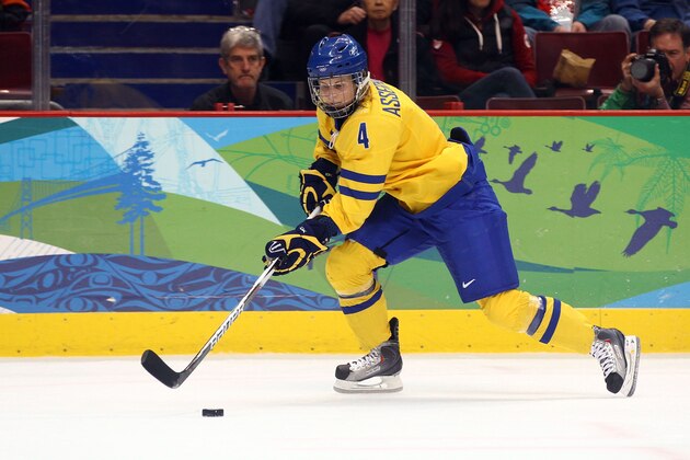 VANCOUVER, BC - FEBRUARY 22:  Jenni Asserholt of Sweden moves the puck against the United States during the ice hockey women's semifinal game game between on day 11 of the Vancouver 2010 Winter Olympics at Canada Hockey Place on February 22, 2010 in Vancouver, Canada.  (Photo by Alex Livesey/Getty Images)