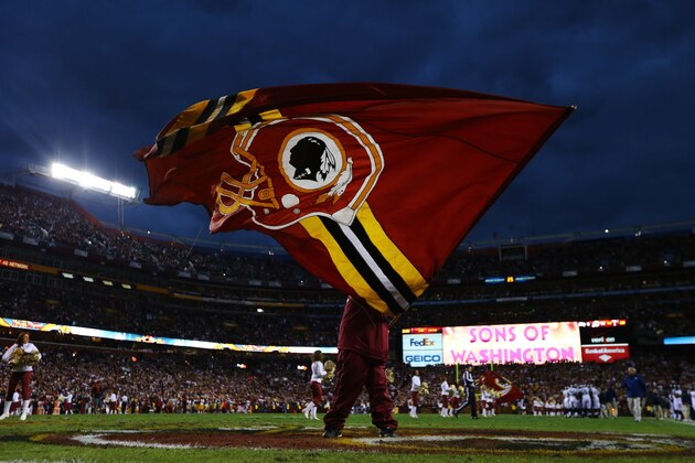 LANDOVER, MD - JANUARY 06:  A Washington Redskins flag is waved prior to the NFC Wild Card Playoff Game against the Seattle Seahawks at FedExField on January 6, 2013 in Landover, Maryland.  (Photo by Al Bello/Getty Images)