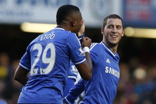 Chelsea's Eden Hazard, right, celebrates his penalty goal against Newcastle United with teammate Samuel Eto'o during their English Premier League soccer match at Stamford Bridge, London, Saturday, Feb. 8, 2014. (AP Photo/Sang Tan)