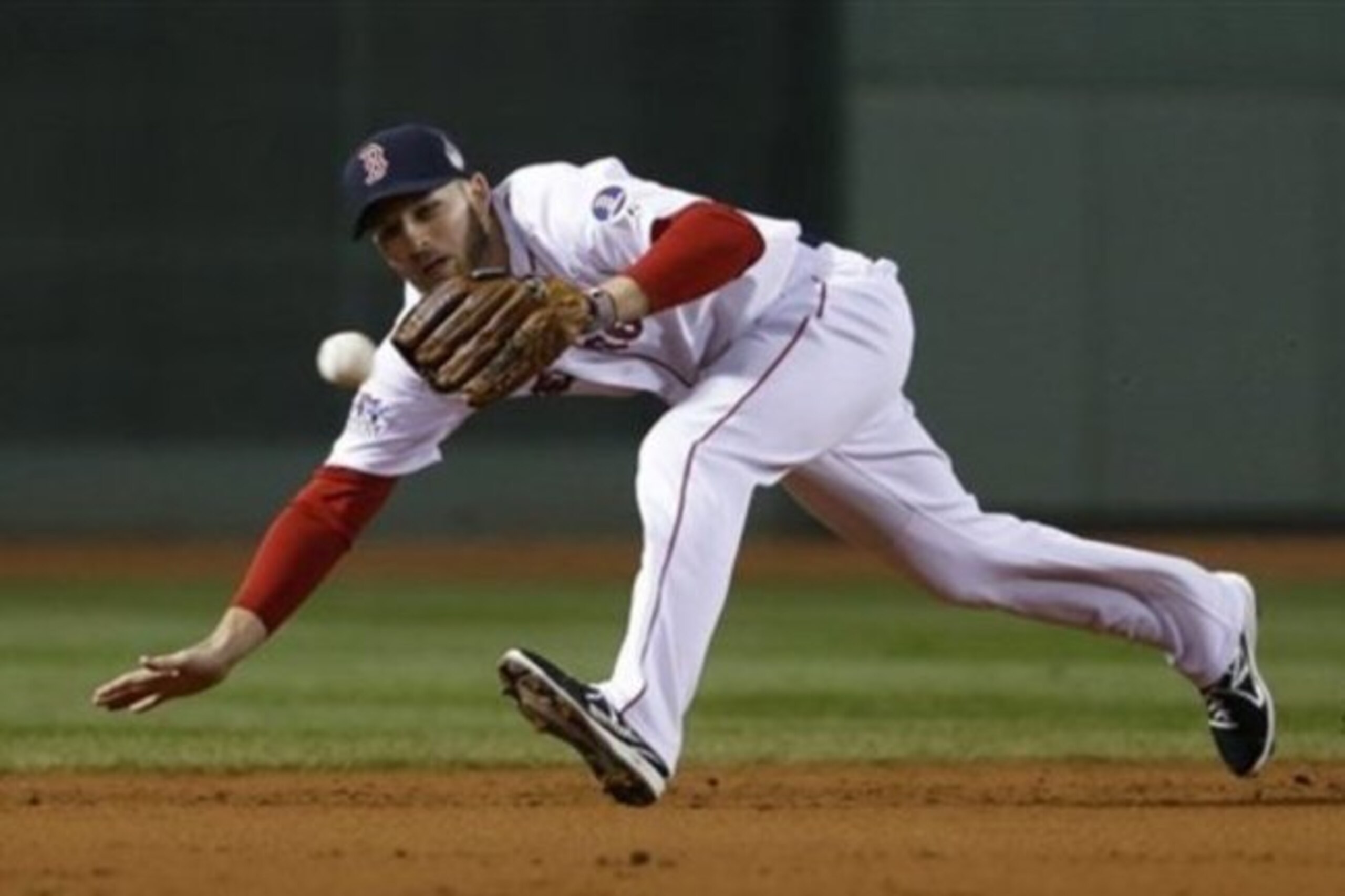 Boston Red Sox shortstop Stephen Drew can not make the play on a single by St. Louis Cardinals catcher Yadier Molina during the second inning of Game 6 of baseball's World Series Wednesday, Oct. 30, 2013, in Boston. (AP Photo/Matt Slocum)
