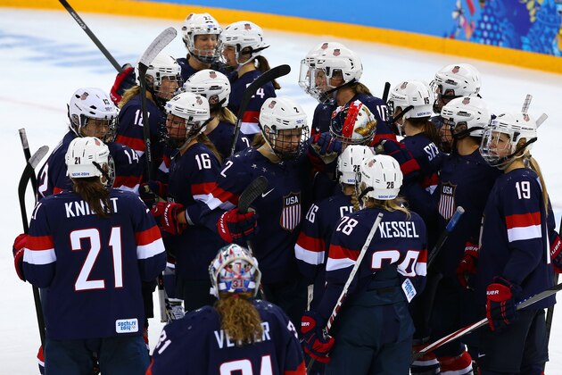 SOCHI, RUSSIA - FEBRUARY 10:  Team USA players celebrate after the Women's Ice Hockey Preliminary Round Group A game on day three of the Sochi 2014 Winter Olympics at Shayba Arena on February 10, 2014 in Sochi, Russia.  (Photo by Martin Rose/Getty Images)