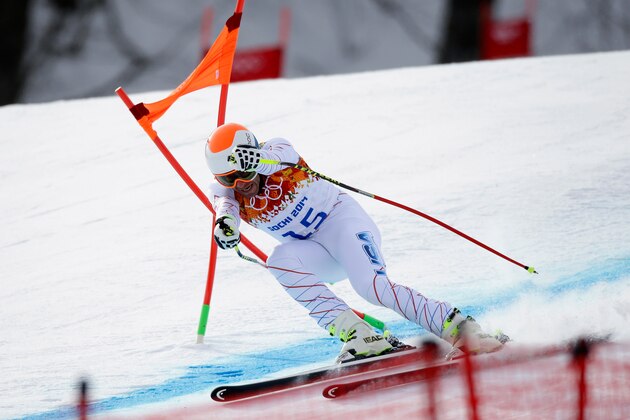 SOCHI, RUSSIA - FEBRUARY 09: Bode Miller of the United Stated hits the gate during the Alpine Skiing Men's Downhill on day 2 of the Sochi 2014 Winter Olympics at Rosa Khutor Alpine Center on February 9, 2014 in Sochi, Russia.  (Photo by Ezra Shaw/Getty Images)