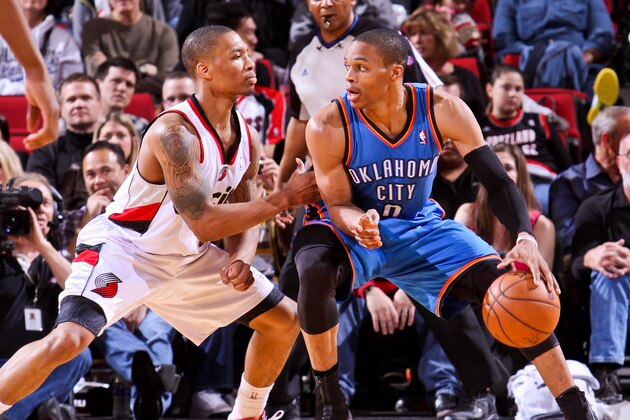 PORTLAND, OR - APRIL 12: Russell Westbrook #0 of the Oklahoma City Thunder posts-up against Damian Lillard #0 of the Portland Trail Blazers on April 12, 2013 at the Rose Garden Arena in Portland, Oregon. NOTE TO USER: User expressly acknowledges and agrees that, by downloading and or using this photograph, user is consenting to the terms and conditions of the Getty Images License Agreement. Mandatory Copyright Notice: Copyright 2013 NBAE (Photo by Sam Forencich/NBAE via Getty Images)