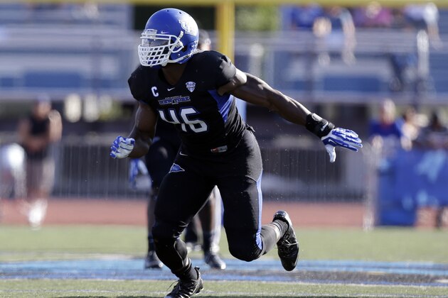 Buffalo linebacker Khalil Mack (46) runs on the field during the first half of an NCAA football game against the Connecticut on Saturday, Sept. 28, 2013, in Buffalo, N.Y. (AP Photo/Mike Groll)