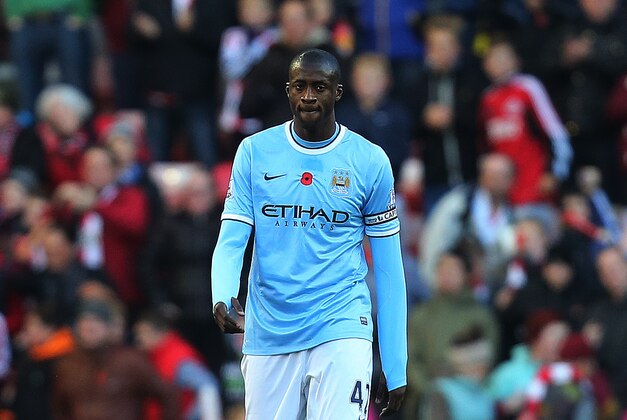 Manchester City's captain Yaya Toure stands dejected as Sunderland's Phil Bardsley scores his goal  during their English Premier League soccer match at the Stadium of Light, Sunderland, England, Sunday, Nov. 10, 2013. (AP Photo/Scott Heppell)