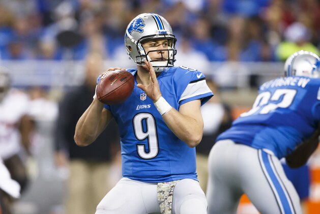 Detroit Lions quarterback Matthew Stafford (9) drops back to pass against the Tampa Bay Buccaneers during an NFL football game at Ford Field in Detroit, Sunday, Nov. 24, 2013. (AP Photo/Rick Osentoski)