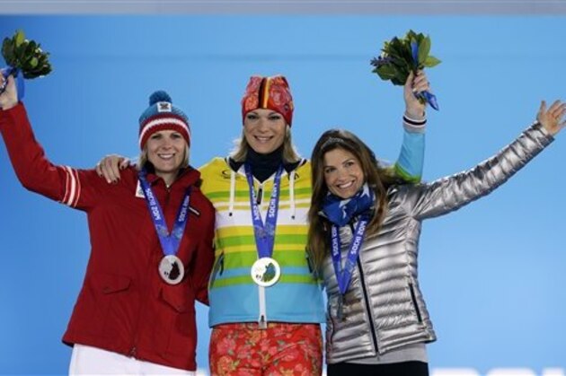 Women's super combined medalists, from left, Nicole Hosp of Austria, silver, Maria Hoefl-Riesch of Germany, gold, and Julia Mancuso of the United States, bronze, pose with their medals at the 2014 Winter Olympics in Sochi, Russia, Monday, Feb. 10, 2014. (AP Photo/Morry Gash)