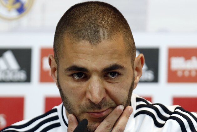 Real Madrid's Karim Benzema from France gestures during a press conference on the 2014 soccer World Cup in Madrid, Spain, Sunday, Dec. 8, 2013. (AP Photo/Andres Kudacki)