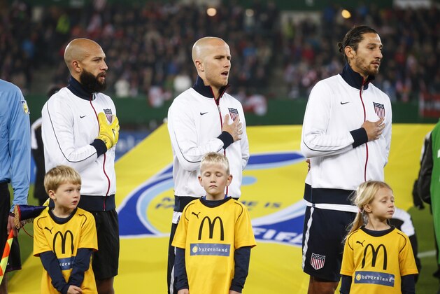 VIENNA, AUSTRIA - NOVEMBER 19:  Goalkeeper Tim Howard, Michael Bradley and Omar Gonzales of USA (L-R) line up for the national anthem prior to the International friendly match between Austria and USA at the Ernst-Happel Stadium on November 19, 2013 in Vienna, Austria.  (Photo by Christian Hofer/Getty Images)