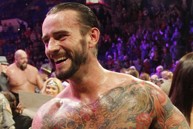 COMMERCIAL  IMAGE - In this photograph taken by AP Images for WWE, WWE Champion CM Punk thanks the troops for their service during WWE’s 9th annual